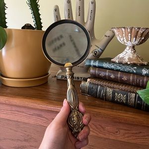 Dark academia magnifying glass